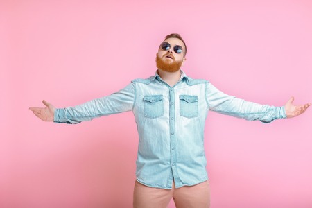 beard man spread his arms out in hand