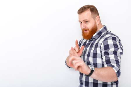 man with red hair and beard in plaid shirtの写真素材