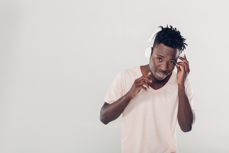 African American man in headphones listening to musicの写真素材