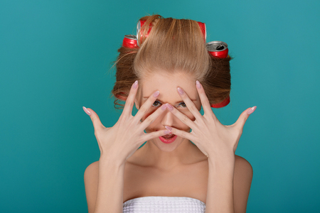 funny blond woman over blue backgroundの写真素材