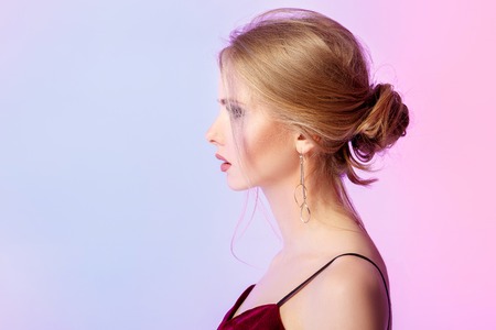 woman in dress in colorful bright lightsの写真素材