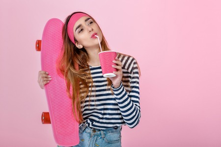 beautiful woman with skate in studio