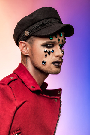 fantasy art makeup. man with rhinestones and jewelsの写真素材
