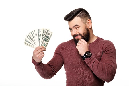 man with beard holding money dollar billsの写真素材