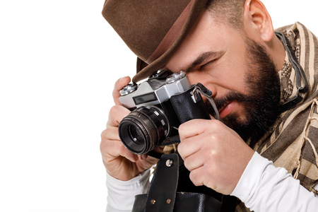 photographer with retro camera takes photosの写真素材
