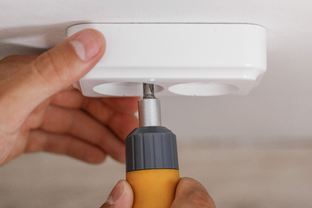 electrician installing electrical socket