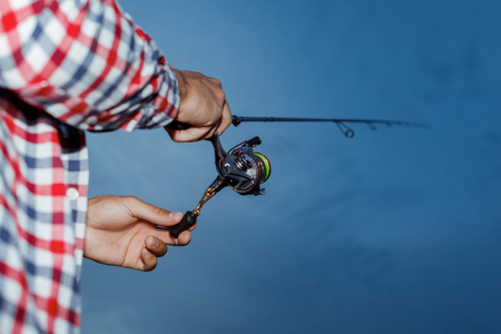 Fishing in the river at sunset.の写真素材