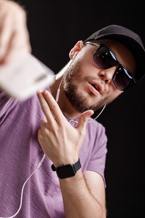 the man listening to music in headphones