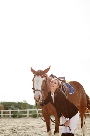 Rider elegant woman riding her horse outsideの写真素材