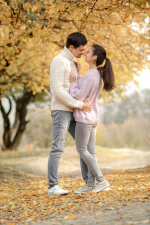 Couple in love in the autumn leavesの写真素材
