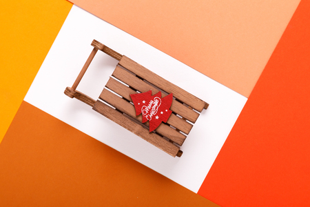 Christmas sleigh in frame of colorful cardboardの写真素材