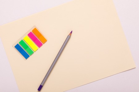 multicolored pencils on multicolored paper, top viewの写真素材