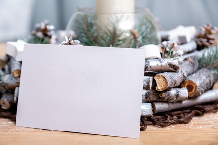 Christmas card on the table near the Christmas decorの写真素材