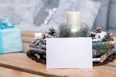 Christmas card on the table near the Christmas decorの写真素材
