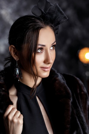 beautiful woman with beautiful hair, makeup and with luxury earringsの写真素材