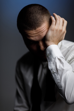young bearded man in a white shirt and bow tieの写真素材