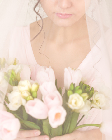 Wedding bouquet of pink tulips in brides handsの写真素材