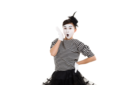 portrait of surprised mime woman artist looking at camera isolated on white backgroundの写真素材