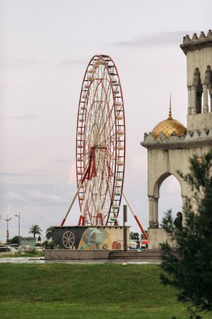 BATUMI, GEORGIA - September 23, 2018: Ferris wheel on cloudy sky background in the daytime in Batumi, Georgiaのeditorial素材
