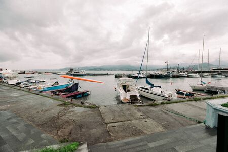 BATUMI, GEORGIA - September 10, 2018: moored in port pleasure boats in the daytime in Batumi, Georgiaのeditorial素材