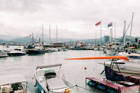 BATUMI, GEORGIA - September 10, 2018: moored in port pleasure boats in the daytime in Batumi, Georgiaのeditorial素材