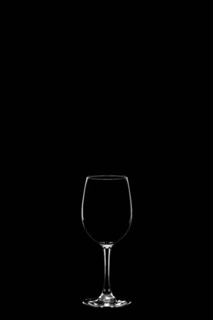 empty wineglass isolated on the black backgroundの写真素材