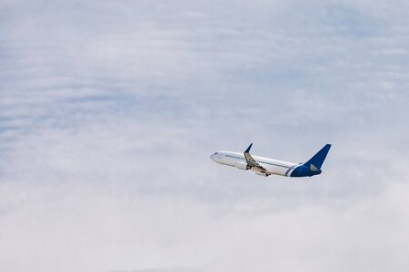 Airplane taking off at sunny day. Passenger plane in flight.