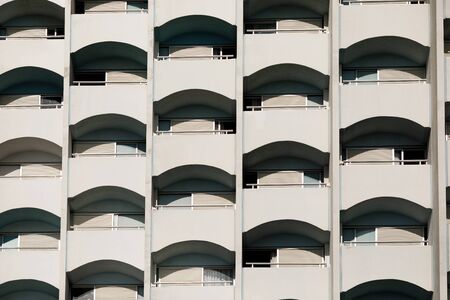 Hotel apartment balcony texture pattern. facade of a apartment buildingの写真素材