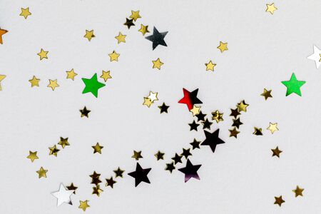 color confetti in shape of stars on white background, close upの写真素材