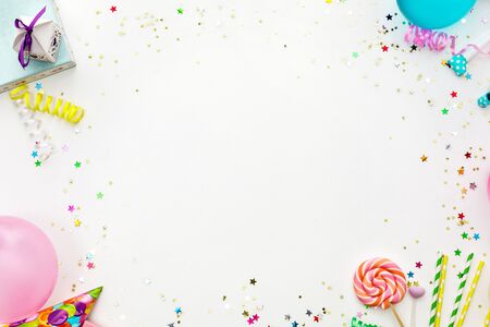 Birthday party background. party hats, balloons, streamers and confetti with copy spaceの写真素材