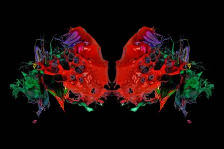 abstract color splash or explosion of colored paints isolated on black background. butterflyの写真素材