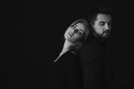 elegant fashion couple. man and beautiful woman in dress. black and white