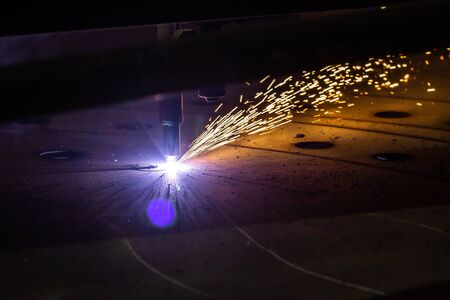Plasma cutting of metal with a cnc. Plasma cutting machine cutting steel sheet. Laser cutter in...