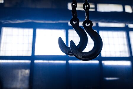steel chain hook of electric hoist. industrial background. Crane cargo hook.の写真素材