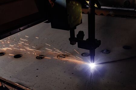 Plasma cutting of metal with a cnc. Plasma cutting machine cutting steel sheet. Laser cutter in...