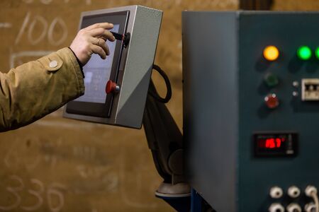 Worker operator using dashboard of CNC machinery or control at machine on the factory. industrial and Manufacturing conceptの写真素材