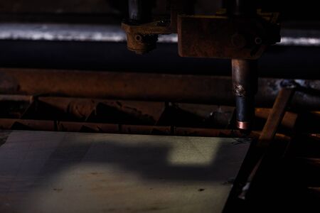 Plasma cutting of metal with a cnc. Plasma cutting machine cutting steel sheet.Industrial metal cutting by plasma laserの写真素材