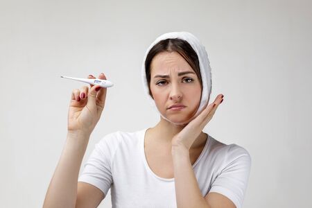 young sad woman suffering from tooth pain, caries. girl having toothache. woman with high...