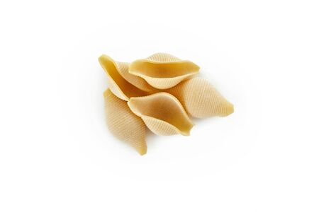 Italian raw dry pasta conchiglioni isolated on white background. Pasta for bakingの写真素材