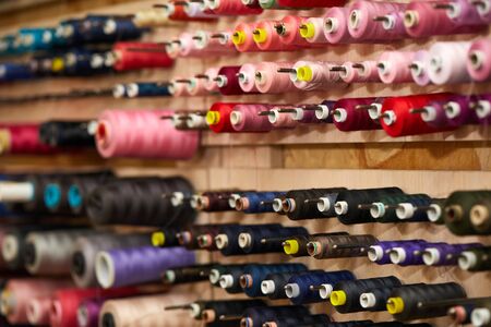 Colorful cotton thread rolls for sewing machine. thread spools for garment industryの写真素材