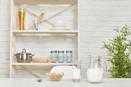 breakfast with cereal with the milk in the morning in kitchen