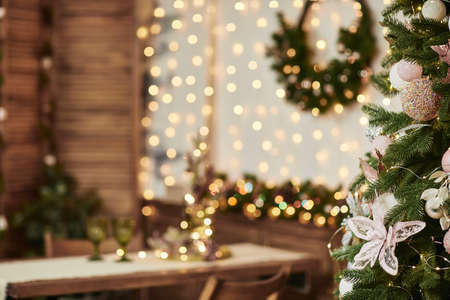 Christmas tree on blur background of christmas decorated interior. copy space for textの写真素材
