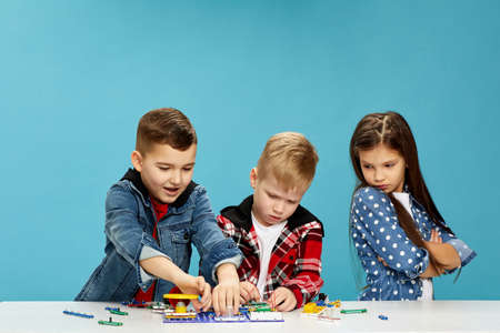 children playing with electronic constructor at studioの写真素材