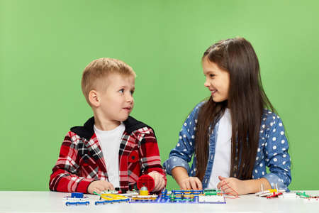 children playing with electronic constructor at studio