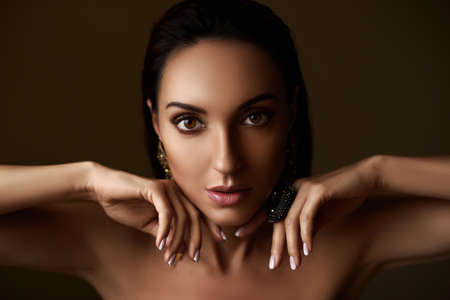 Elegant fashionable young woman with dark hairの写真素材