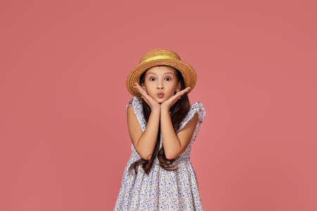 cute little child girl in summer dress and hatの写真素材