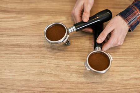 two holders for a coffee machine with freshly ground coffee