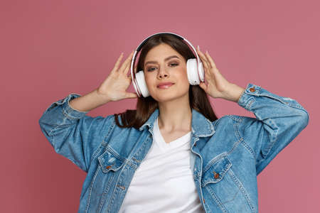 beautiful woman in headphones listening to music