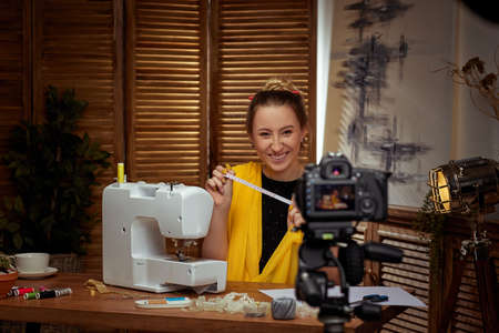 seamstress blogger shooting with camera for blogの写真素材