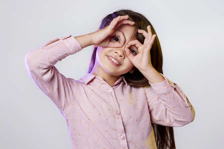 funny smiling little child girl fooling around